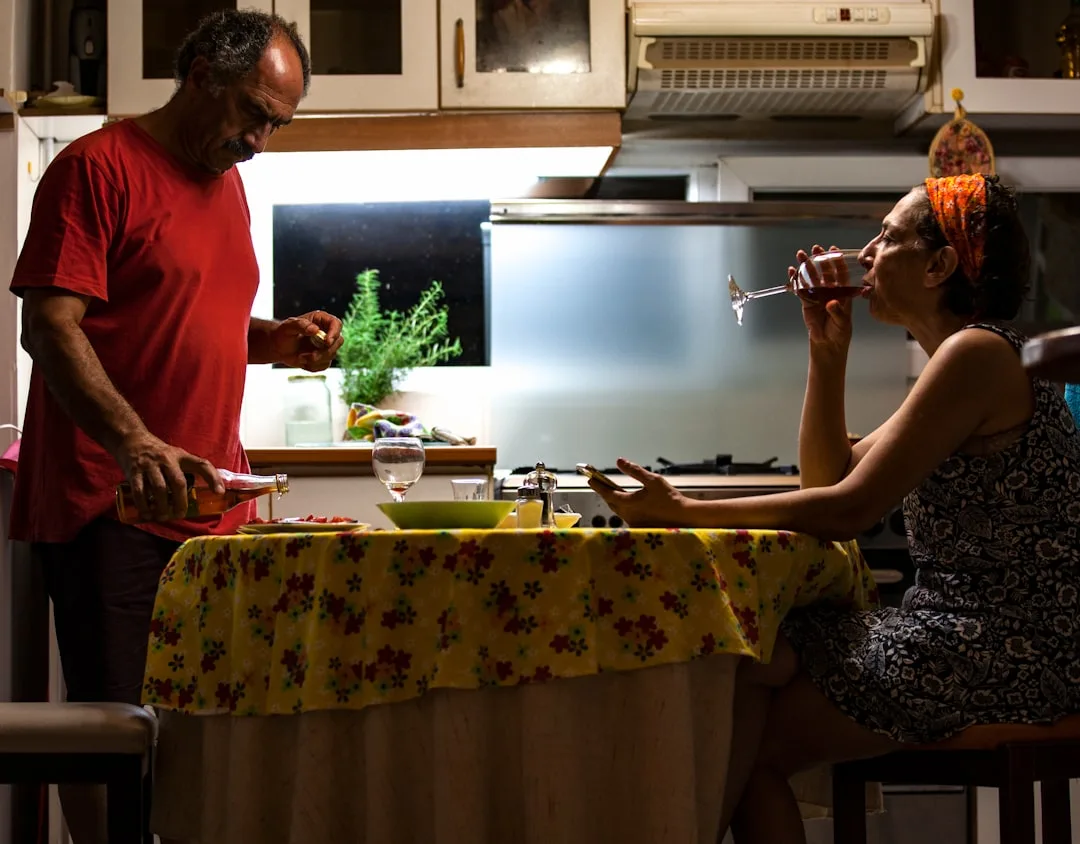 couple arguing over medical bills at kitchen table