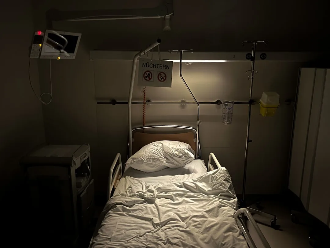 shocked patient in hospital bed with doctor candid natural lighting moody