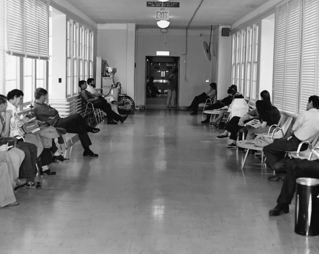 stressed patient in clinic waiting room candid natural lighting moody